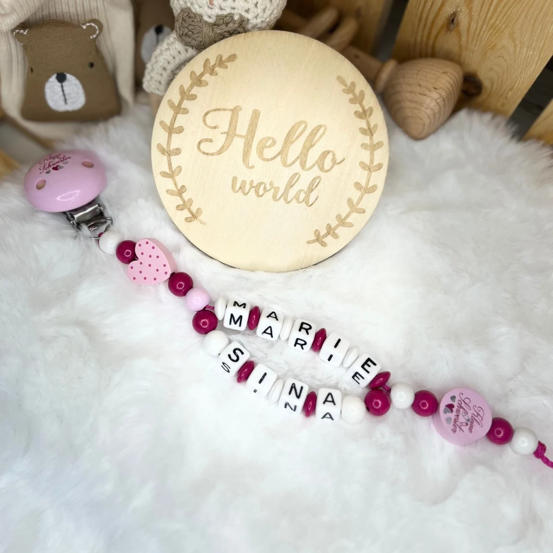 Schnullerkette mit Doppelnamen - Kleine Schwester | Herz | Rosa, Pink & Weiß