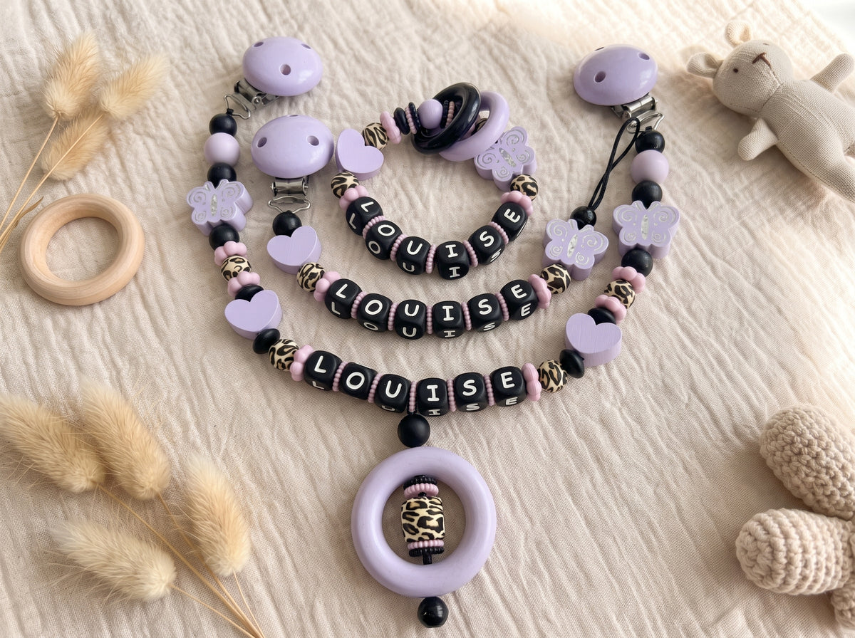 Personalisierte Baby Geschenkset 3er Set Flieder mit Namen – Schnullerkette, Greifling & Kinderwagenkette im Leo Design