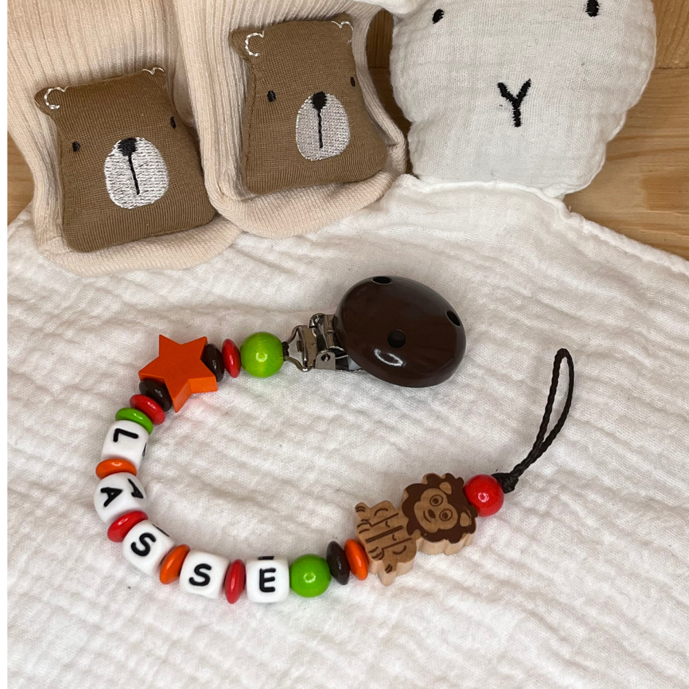 Schnullerkette für Jungen mit Namen - Löwe - orange braun grün