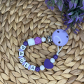 Schnullerkette für Mädchen mit Namen - Lilatöne - Babygeschenk