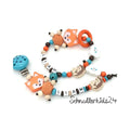 2teiliges Sparset - Schnullerkette + Greifling - Orange/Blau + Fuchs